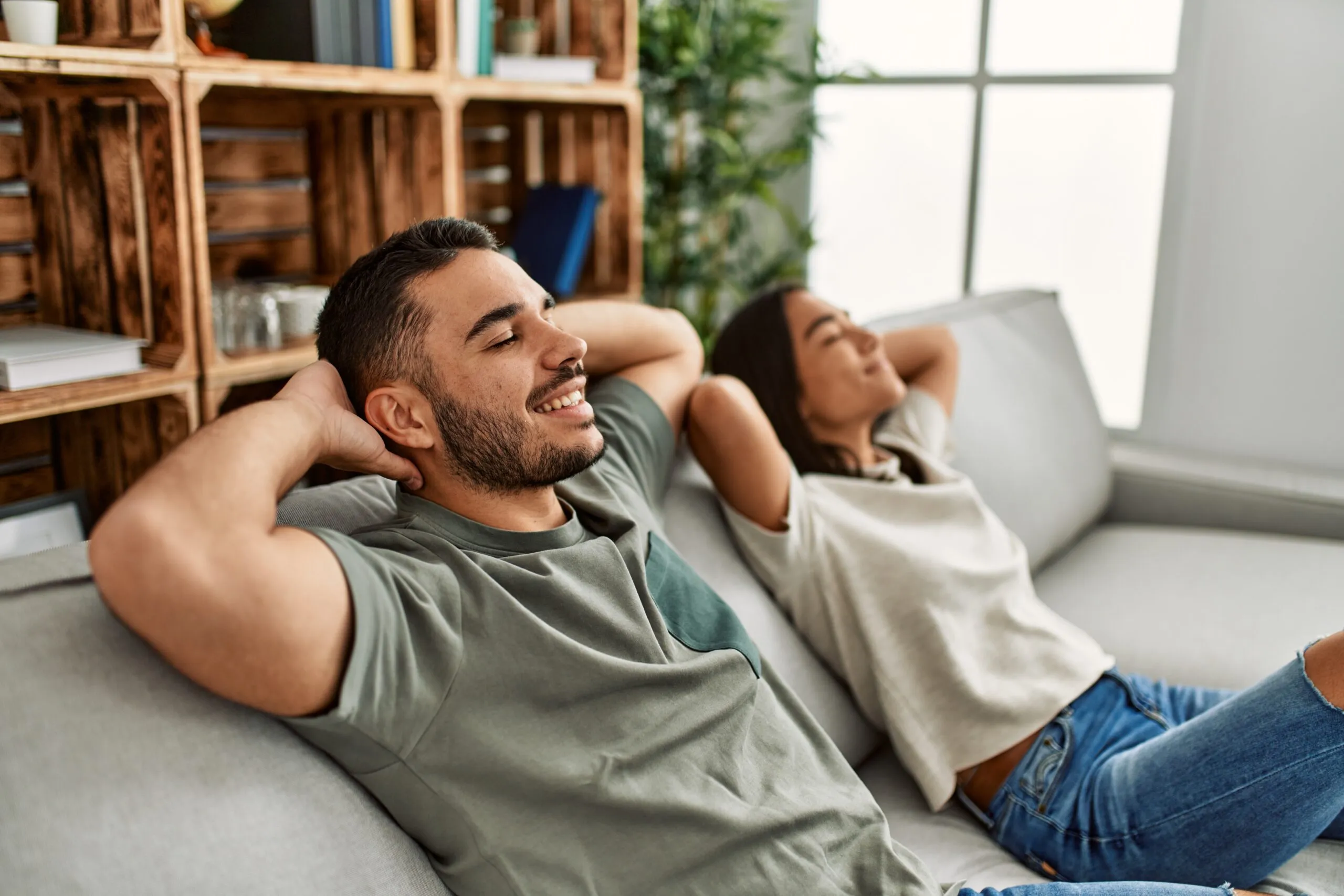 Homeowners relaxing comfortably in a cool Southwest Florida home